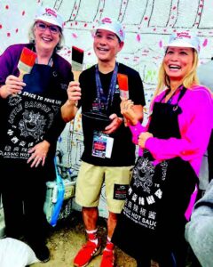 Shelley Hoss, far left, attends a mural brush ceremony in LittleSaigon. Tam Nġuyen, second from left, co-owns Advance Beauty College in Garden Grove and serves on the OCCF board